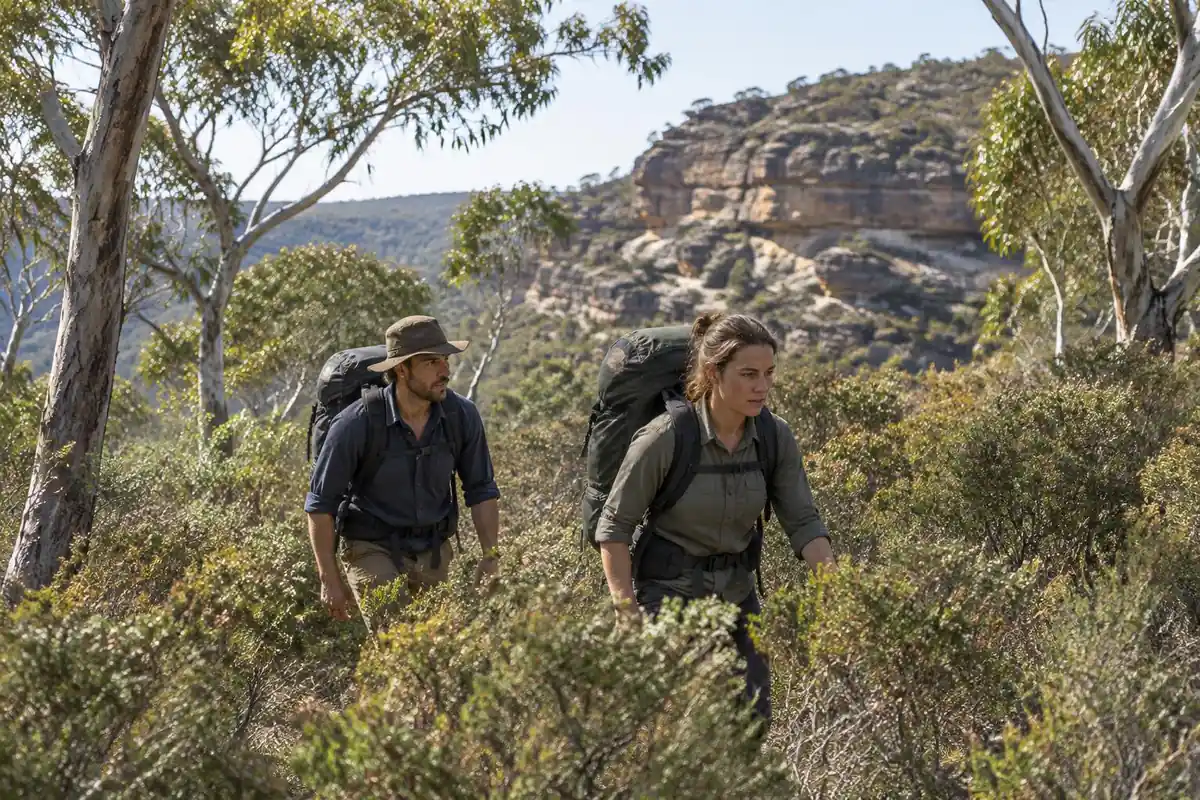 Bushwalkers pushing through scrub and eucalypts with durable packs