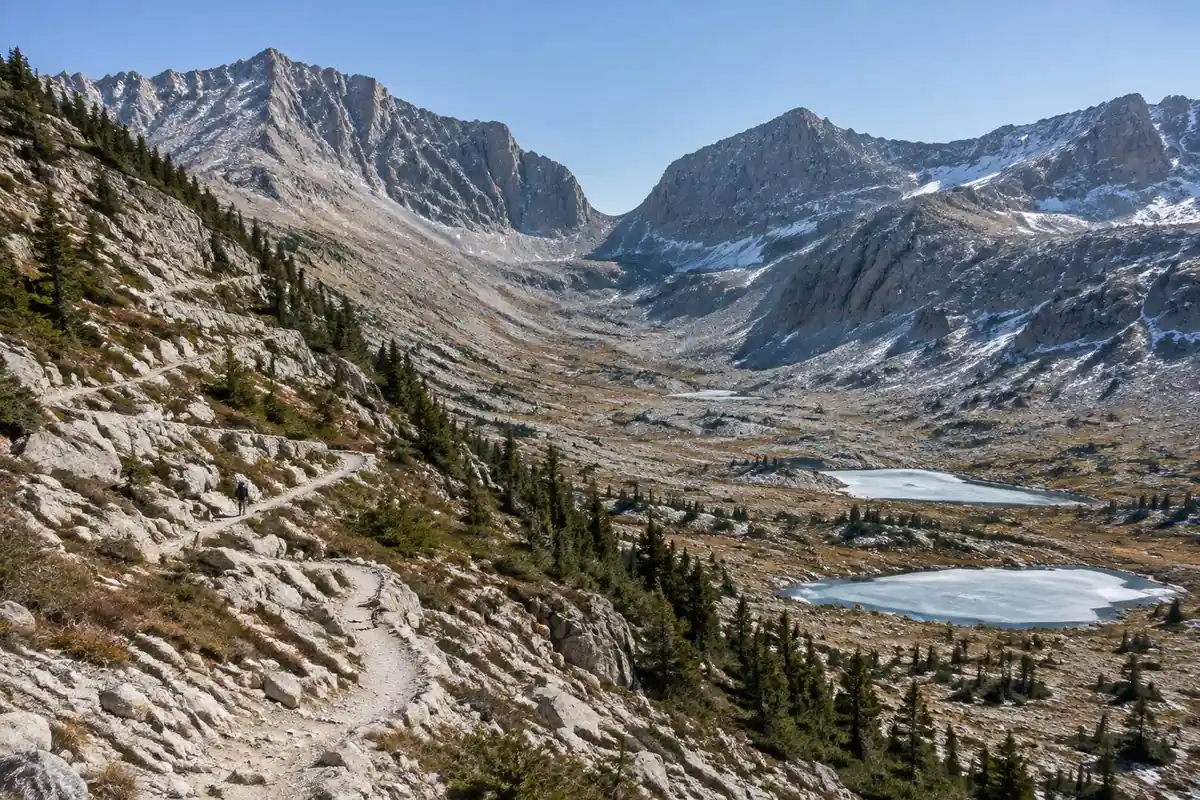 Granite pass with switchbacks above a barren alpine basin