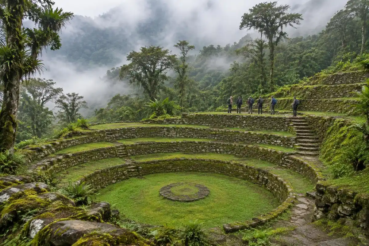 Mossy circular stone terraces on a jungle hillside with visitors on the steps
