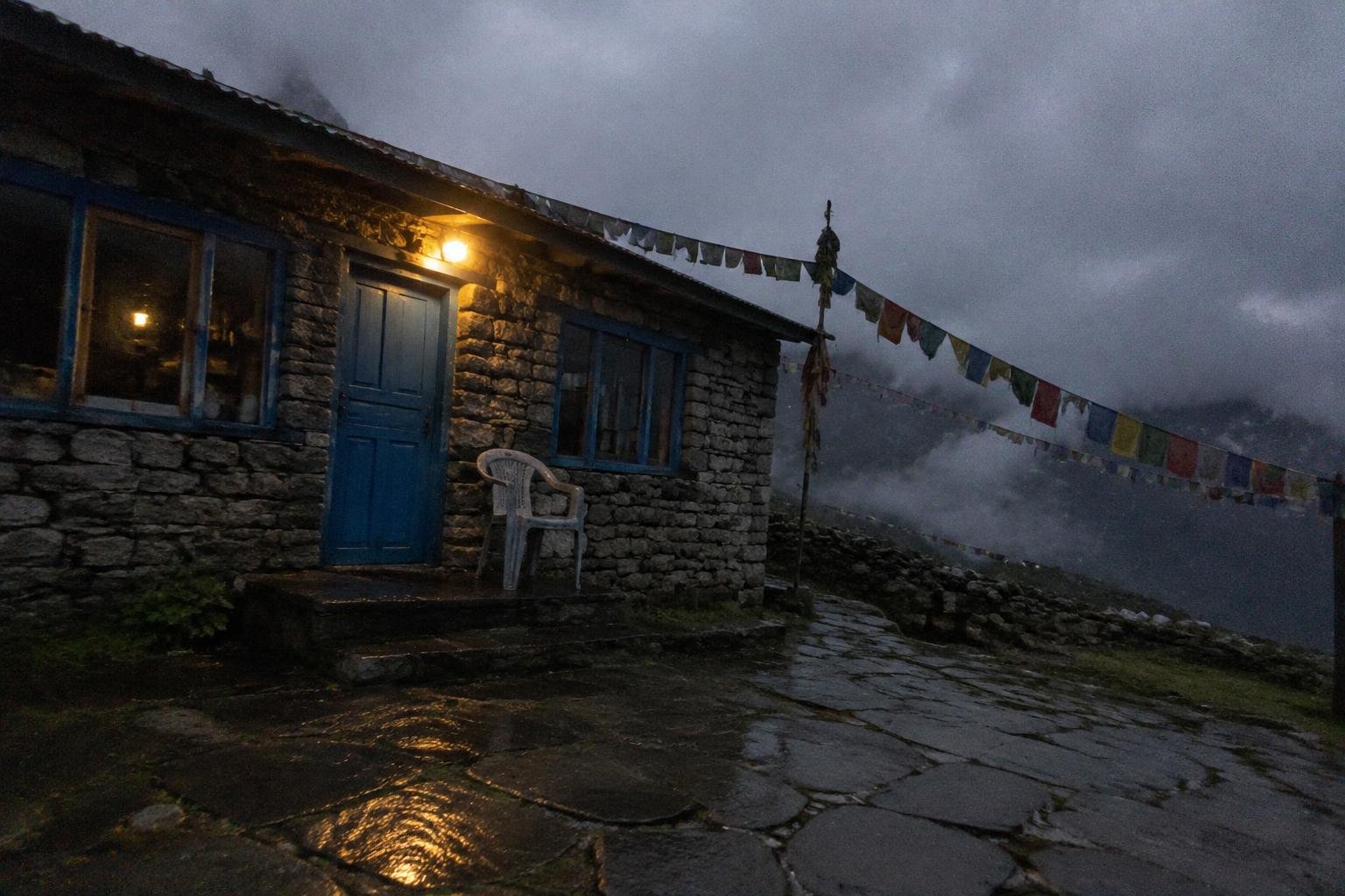 A teahouse doorway with a lit lamp in grey cloud